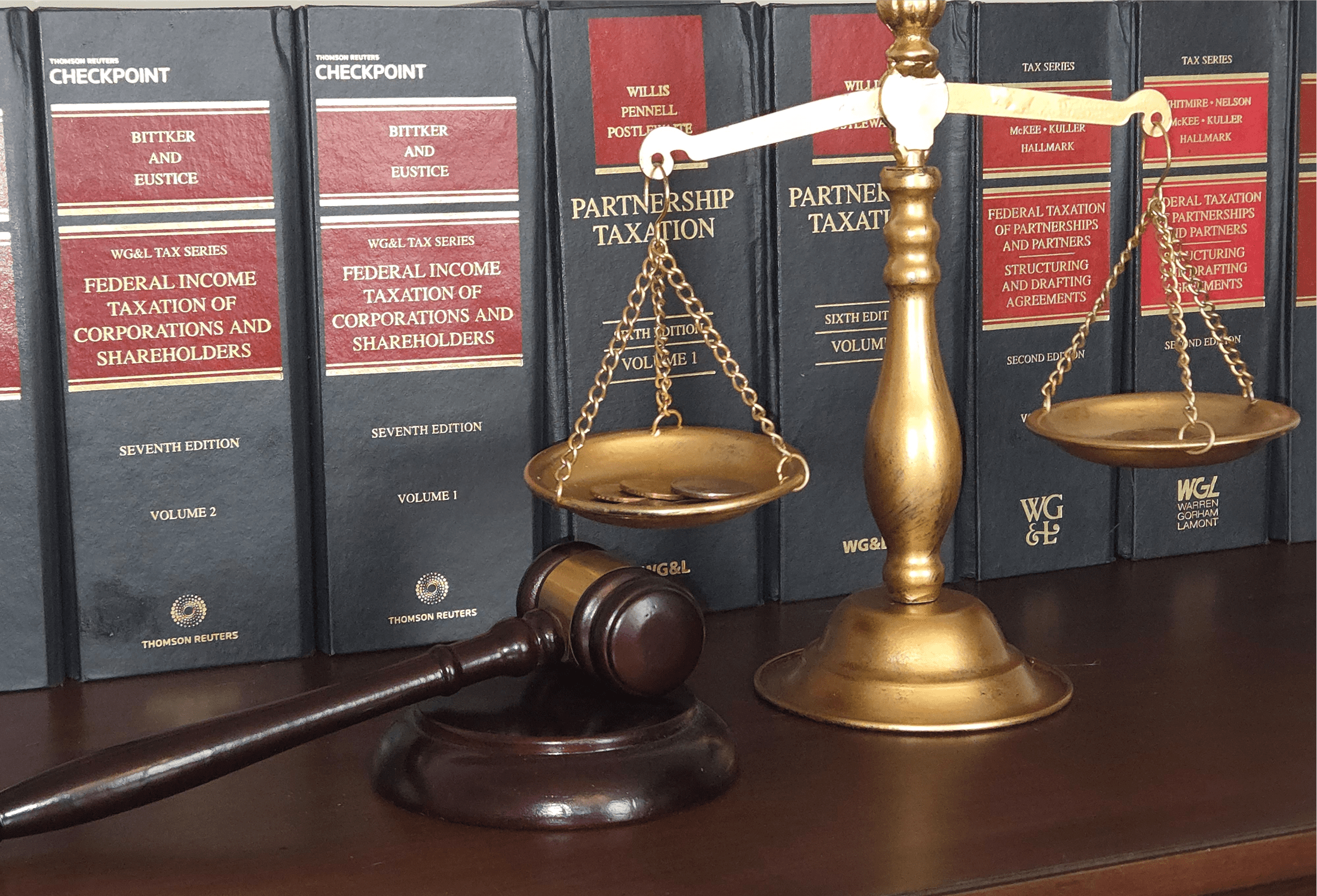 Scales, gavel, and law books on shelf.