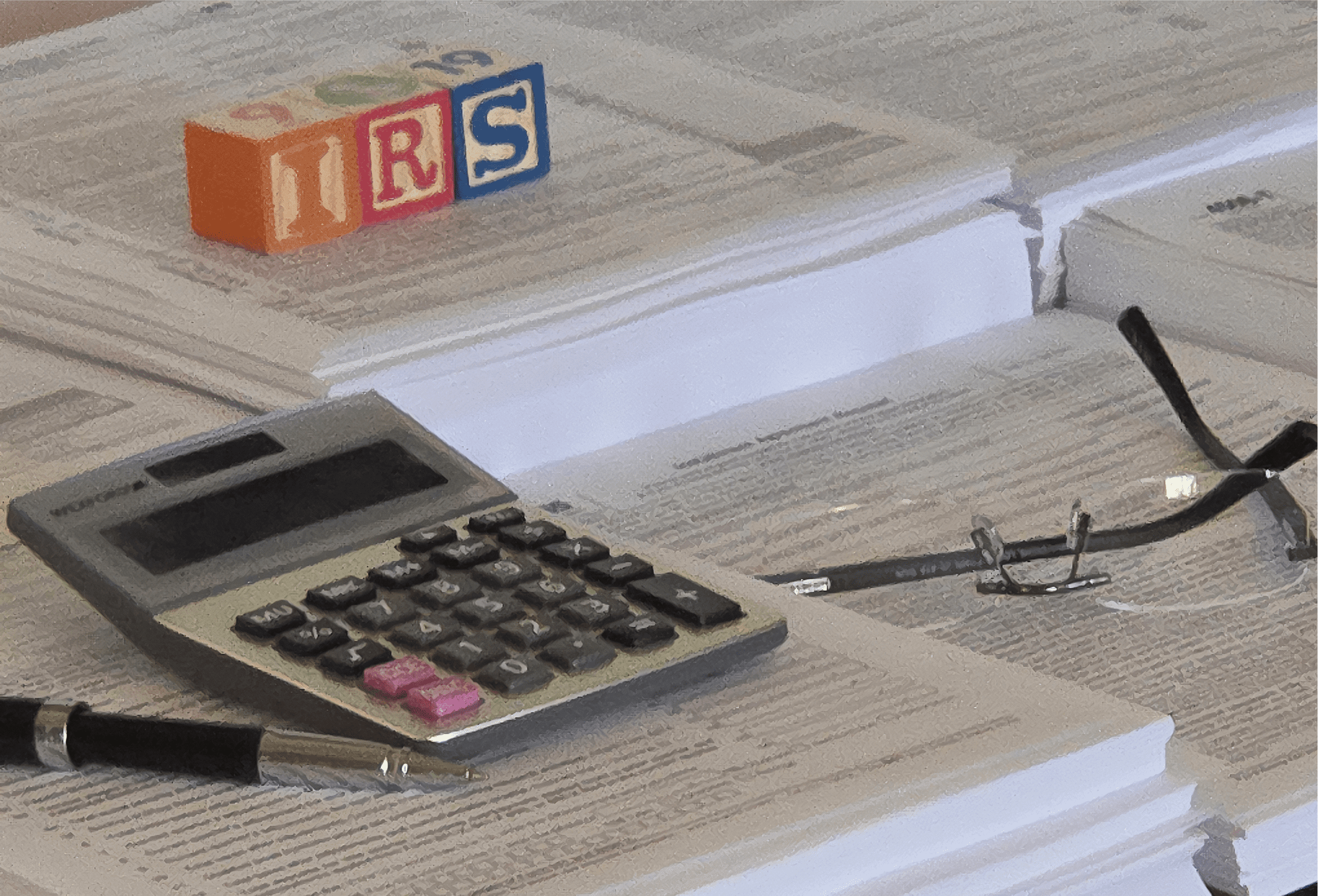 Calculator and glasses on tax documents.