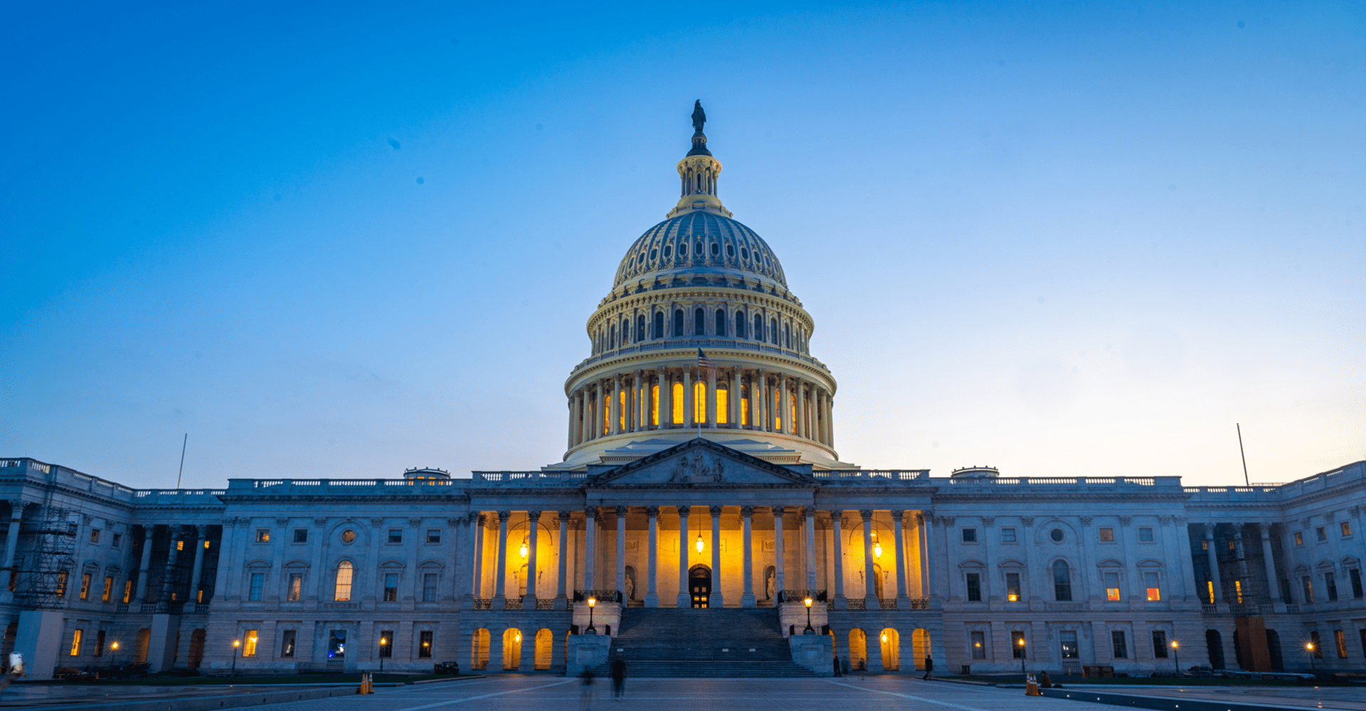 U.S. Capitol building at dusk, illuminated.