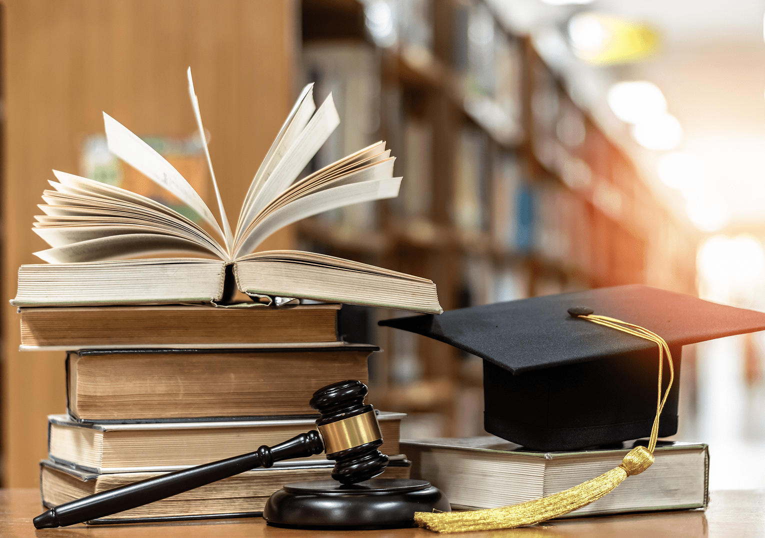 Education and law symbols on table